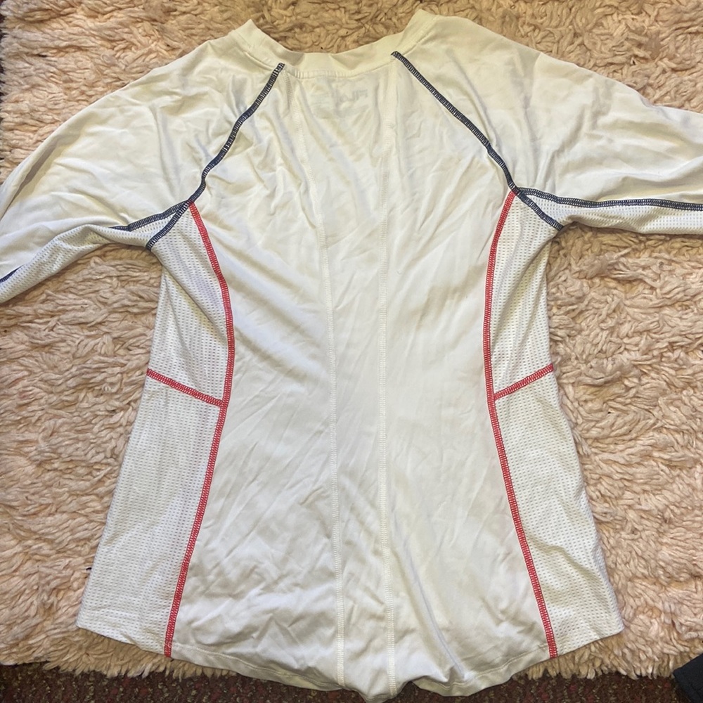 Back of white Fila long sleeve top